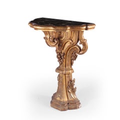 A pair of 18th century Italian carved gilt wood console tables