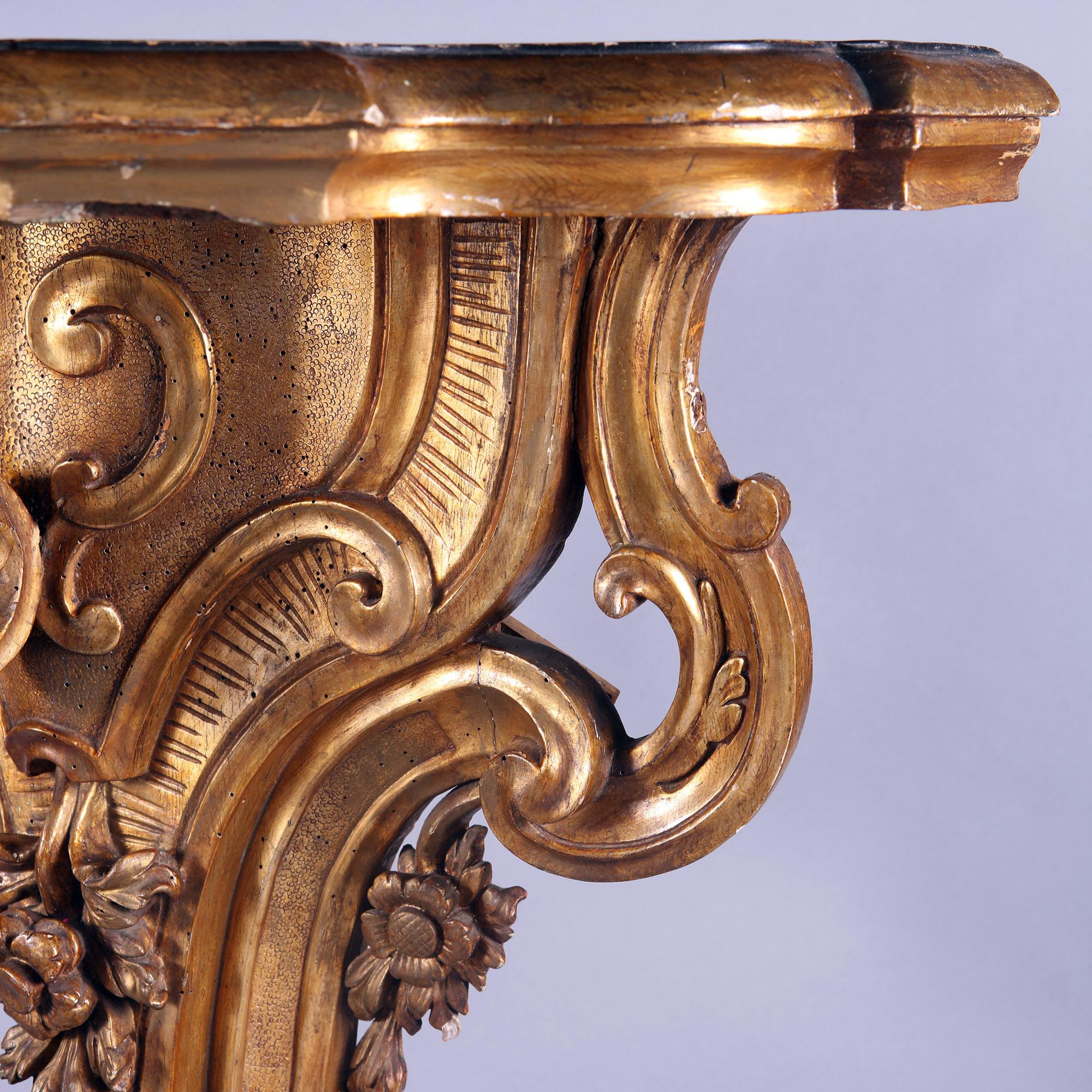 European A pair of 18th century Italian carved gilt wood console tables  For Sale