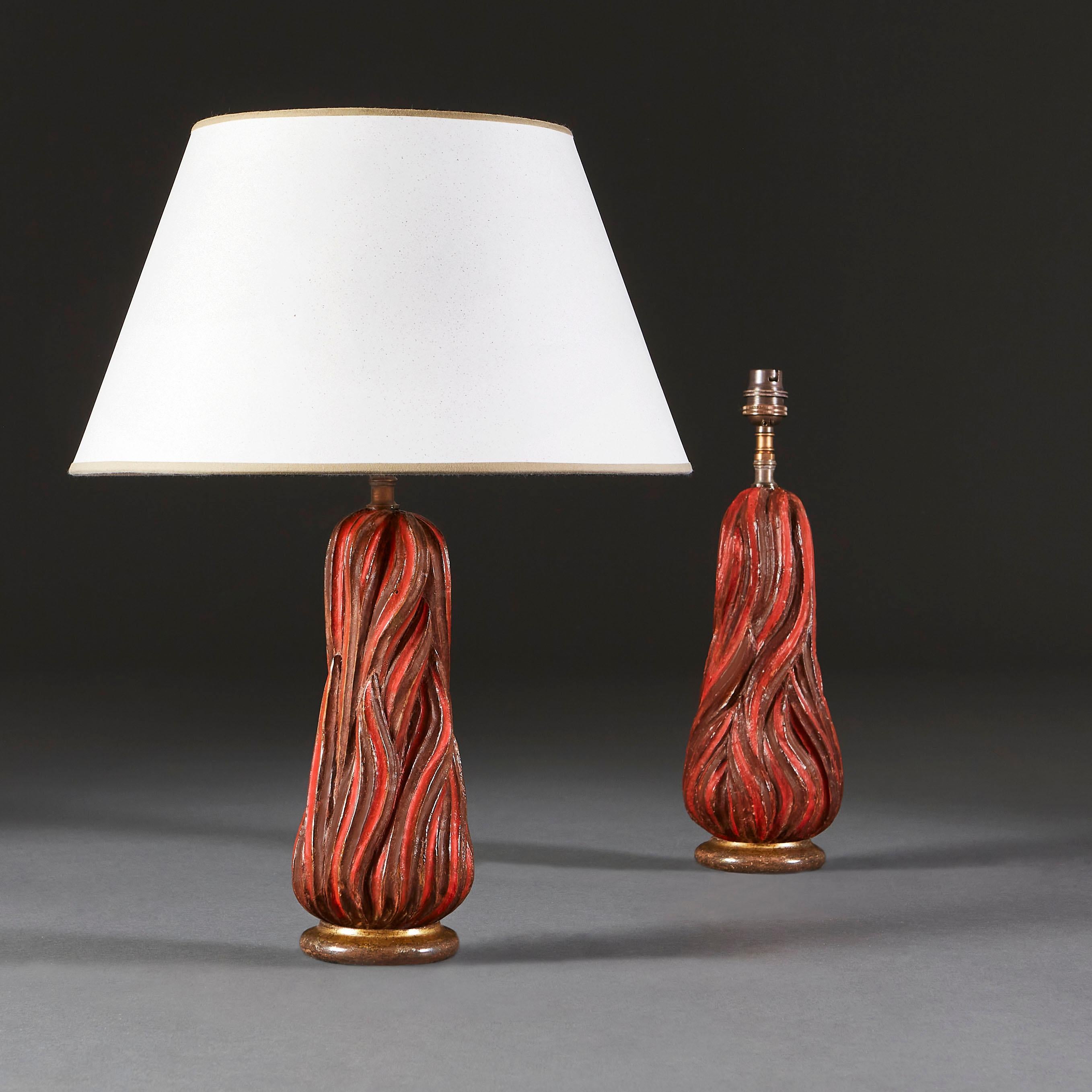 A pair of carved wooden finials in the shape of flames, painted red and now as lamps.

Currently wired for the UK. Please enquire for rewiring services.

Please note: Lampshades not included.