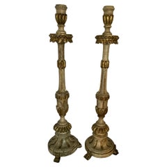 A Pair of 18th Century Italian painted and Gilt Wooden Candlesticks