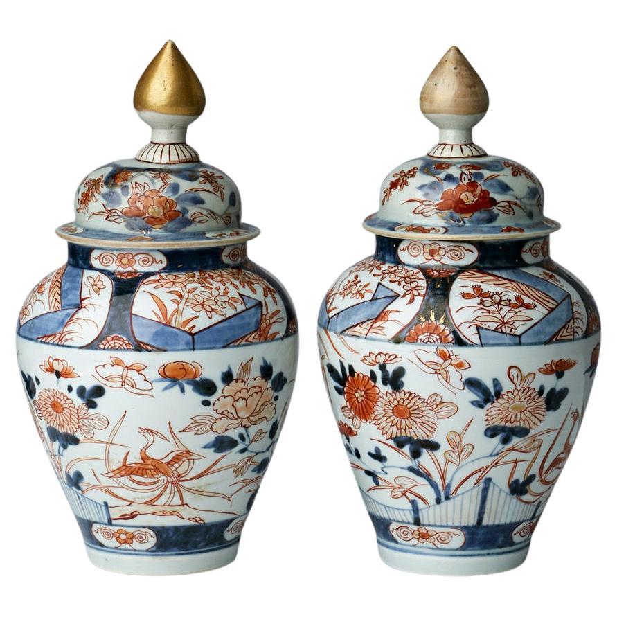 Pair of 18th Century Japanese Imari Urns with Lids