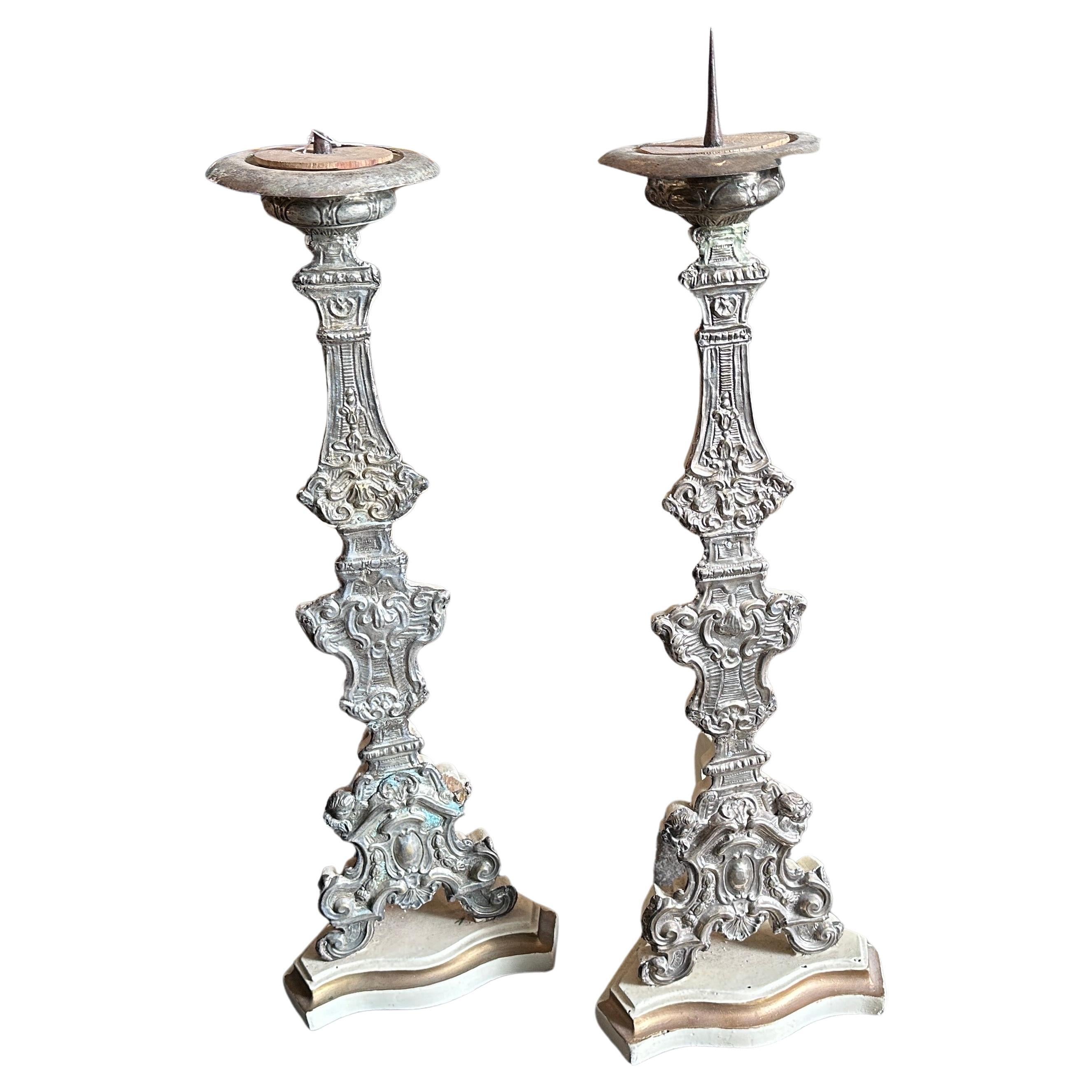 A pair of 18th-century Louis XVI metal covered wood Sicilian torchères exquisite examples of the neoclassical style, combining the elegance of Louis XVI design with the regional influences of Sicilian craftsmanship, have been exquisite decorative