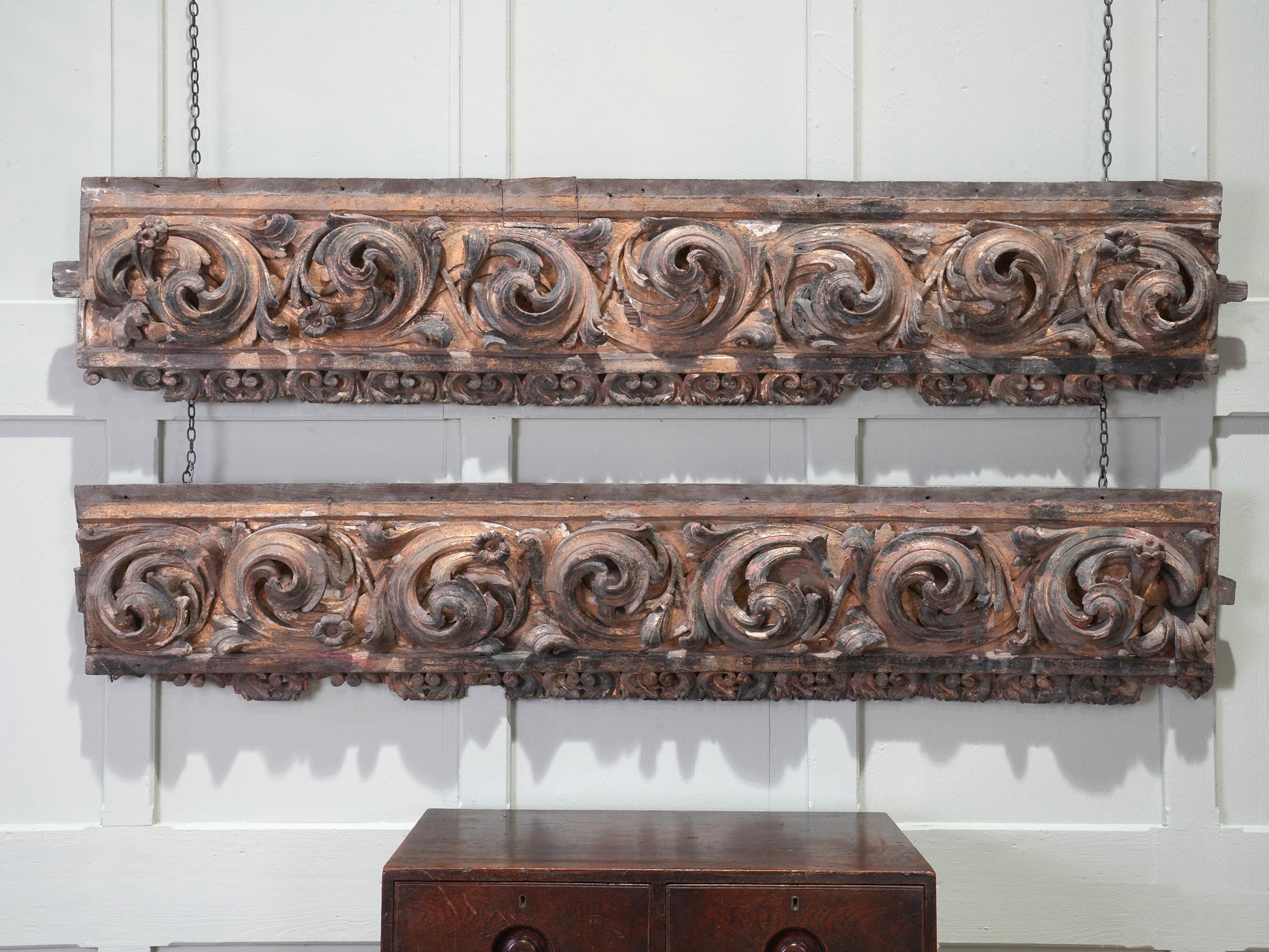 A pair of carved and gilded chestnut architectural elements.

Both vigorously carved in high relief from a single section of chestnut with its first gilded finish still in place, they are a masterpiece of the Baroque style used widely throughout