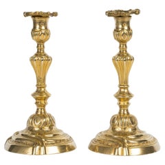 A Pair of 18th Century Regence Period Ormolu Candlesticks.