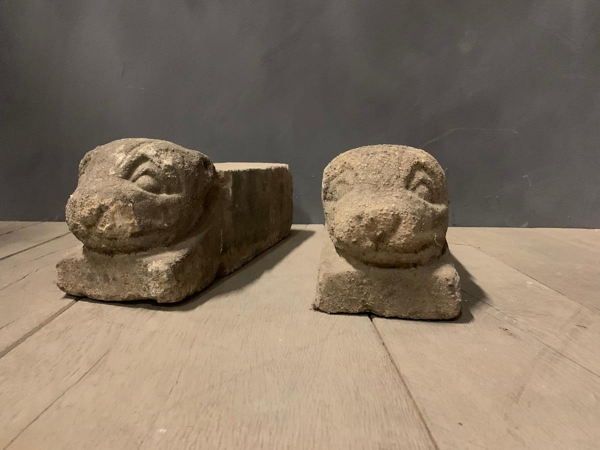 A rare pair of 18th century French volcanic stone firedogs.