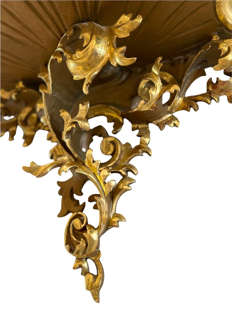 A pair of 18th Century Venetian Rococo carved wood and gold gilded wall shelves. These are finely carved from wood and have a delicate curled scroll design.
 