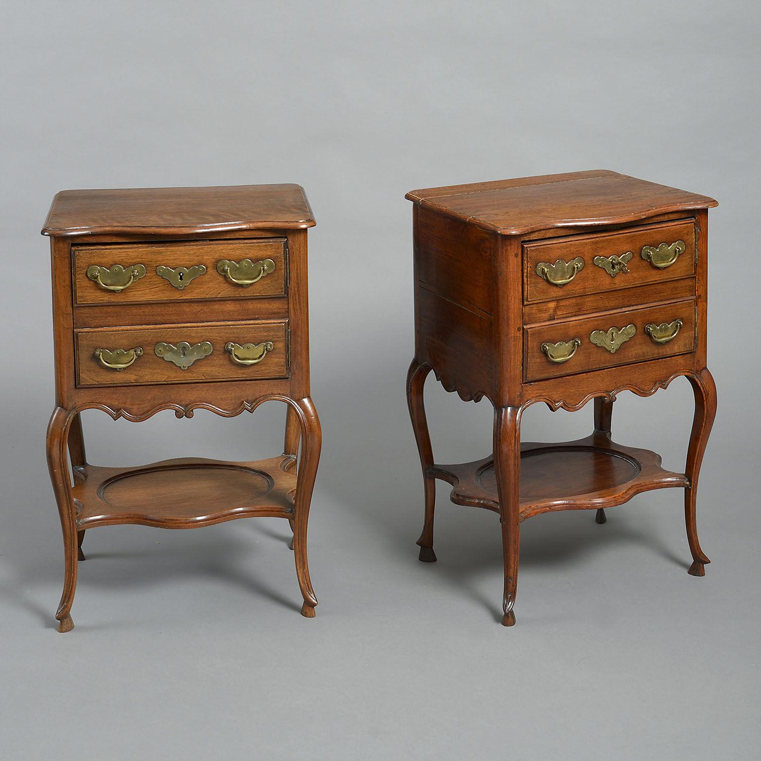 A pair of Spanish walnut and chestnut bedside tables. The serpentine fronted tops above cupboards simulating a pair of drawers, raised on cabriole legs joined by shelf stretchers, with engraved brass handles and lockplates. One mid-18th century, the