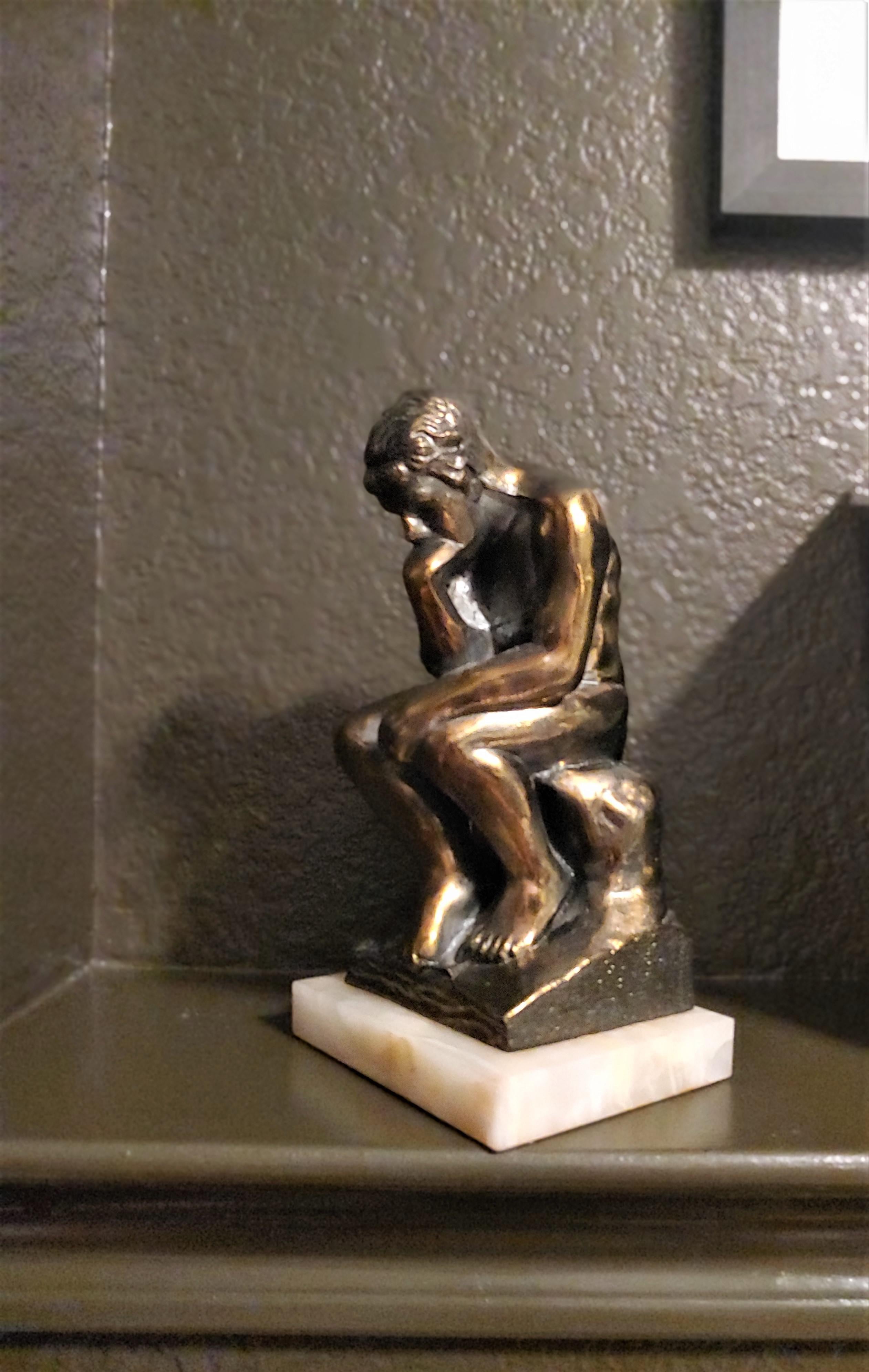 Bronzed Pair of 1920s Brass Figurative Bookends with White Onyx Base For Sale