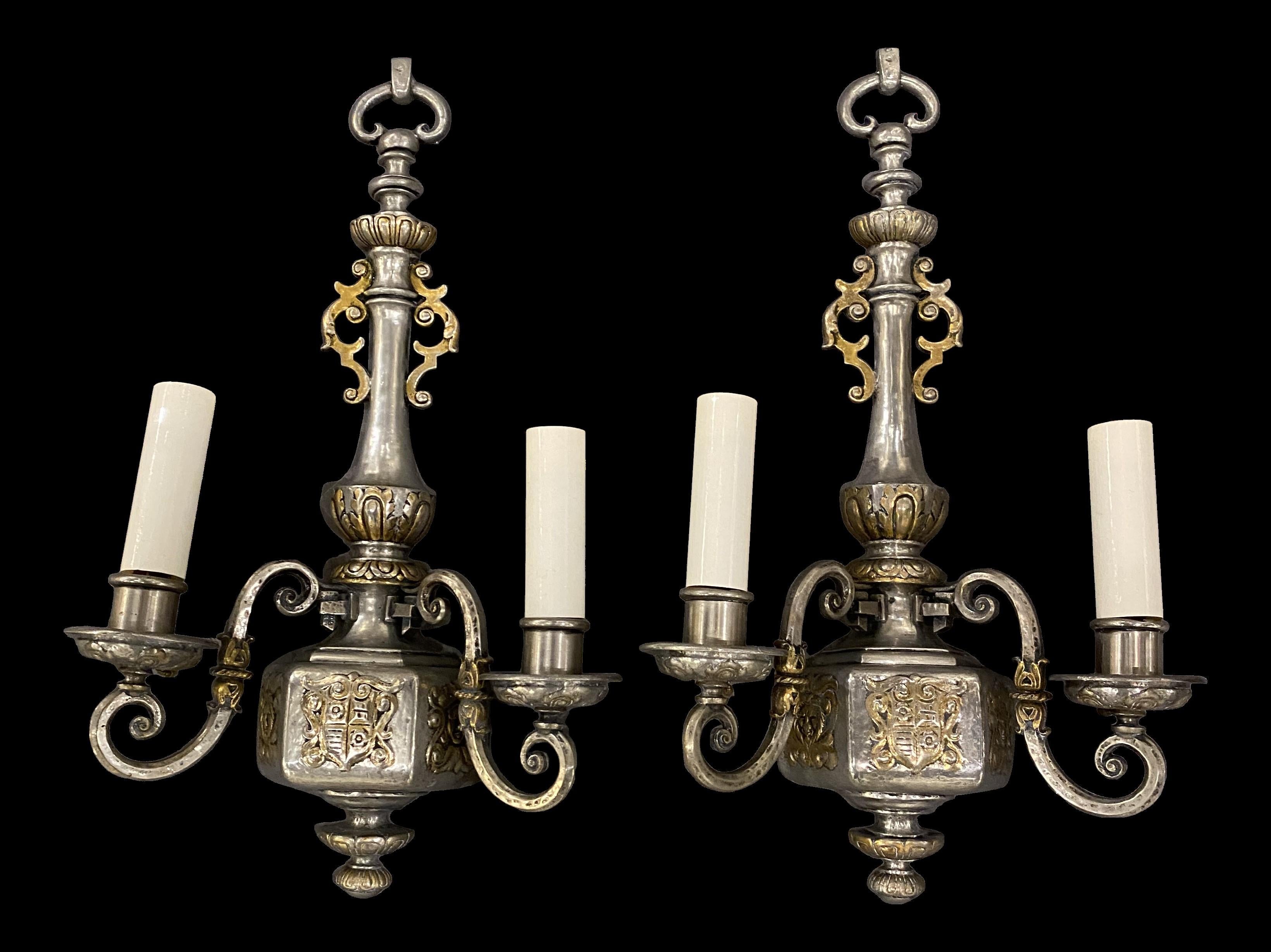 A pair of circa 1920's Caldwell silver plated double light sconces with gilt details