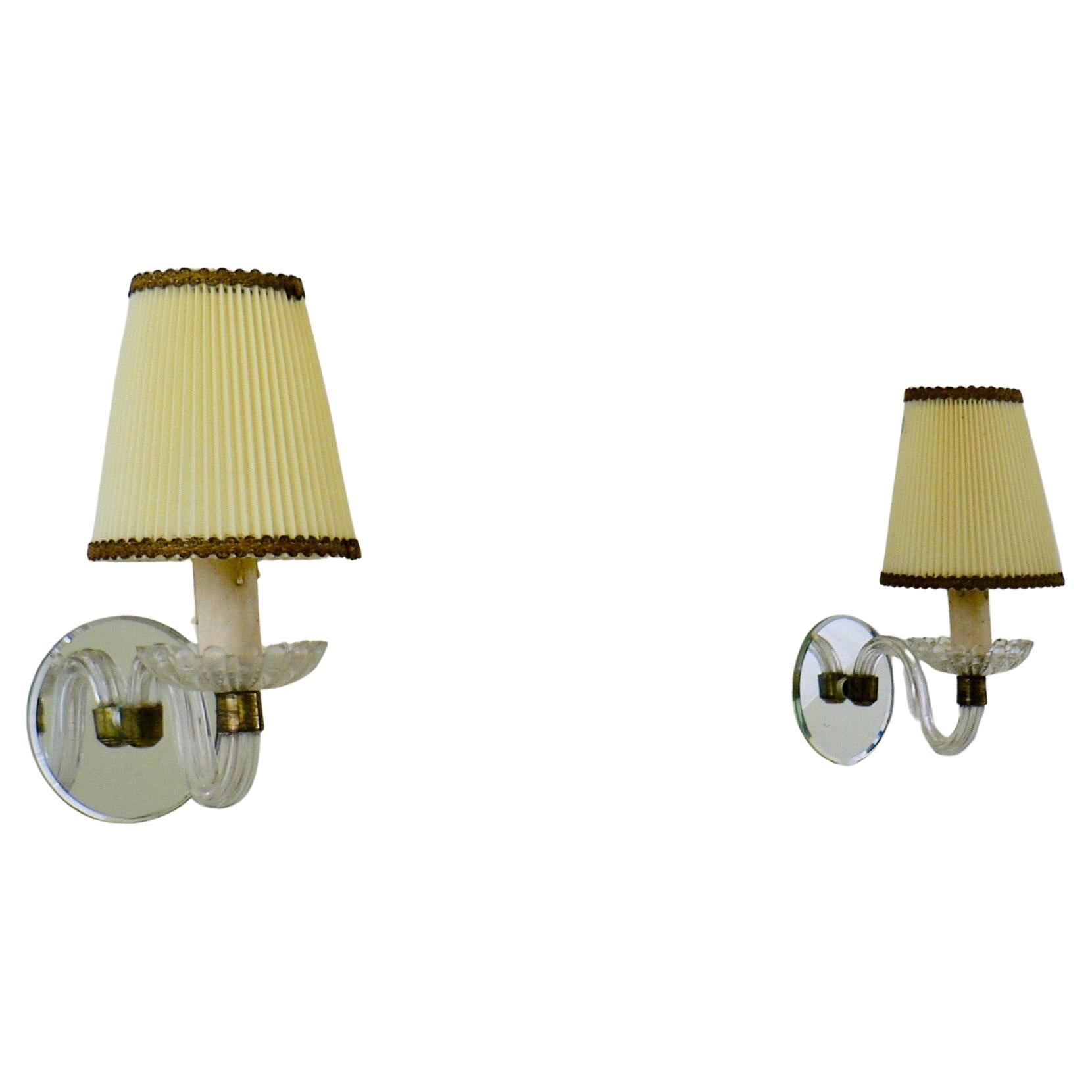 A pair of 1930 glass et mirror wall sconce lamps from France.