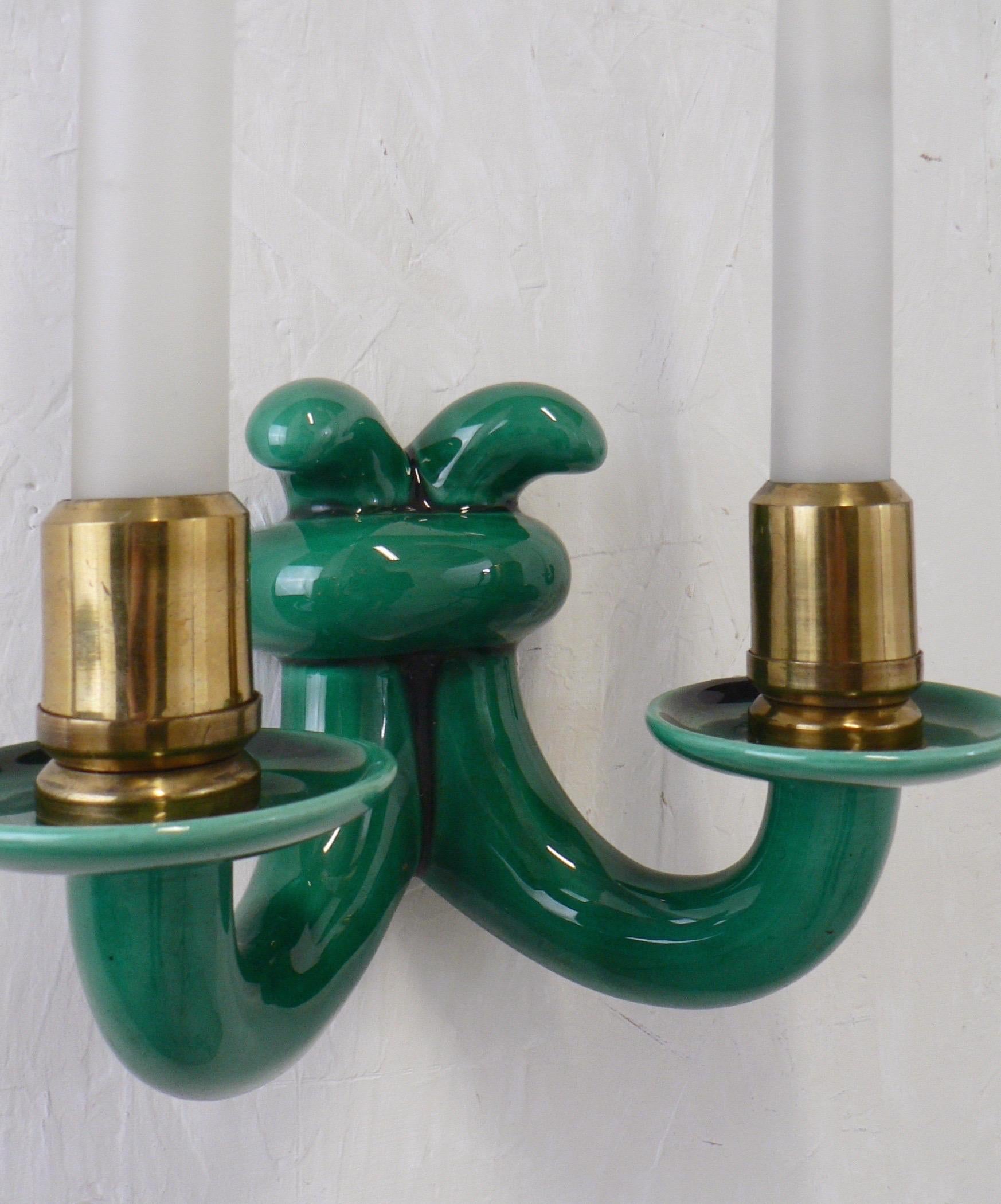 A pair of 1930 Sevres porcelain wall sconce lamps from France, featuring green enameled ceramic on brass bases. 
glass tulips on the lightbulb.

US rewiring on request.