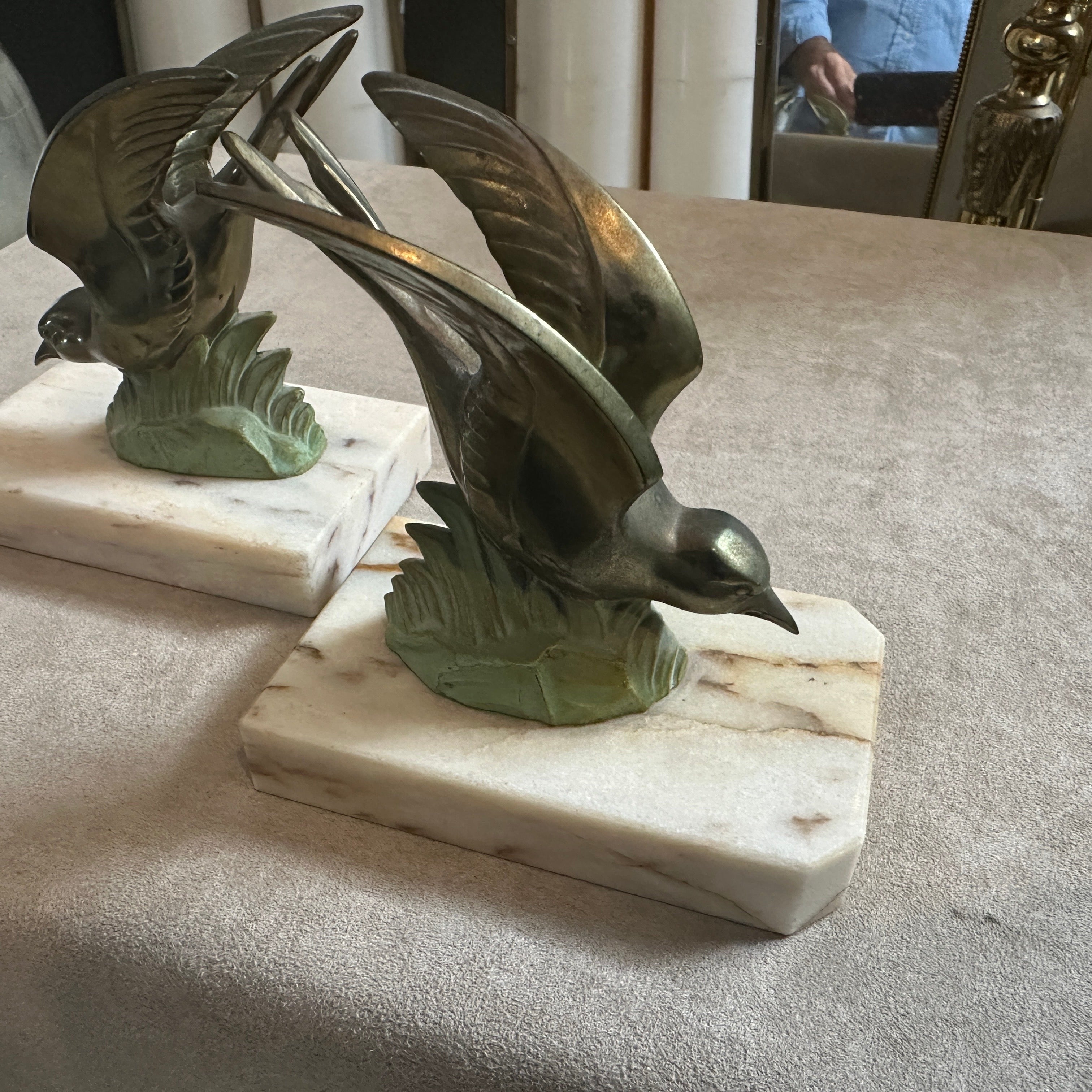 This pair of bookends has been an elegant addition to a desk, bookshelf, or study during the Art Deco period. Today, such items are cherished for their craftsmanship, unique design, and as collectible pieces reflecting the stylish refinement of the