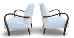 A Pair of 1930s Art Deco “Swan Song” Armchairs in Ivory Bouclé