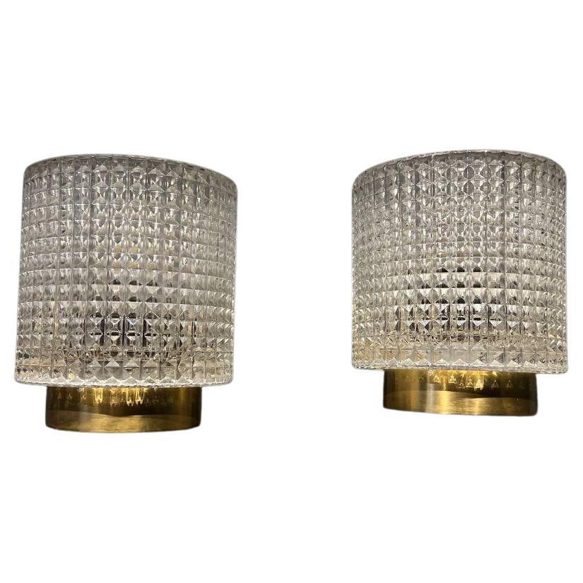 A pair of circa 1930's sconces with a large, beautiful cut crystal inset...