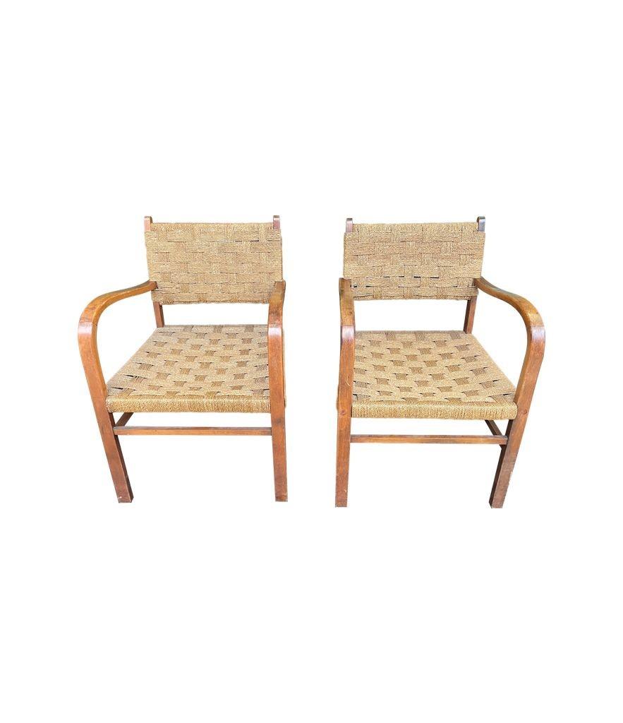 A lovely pair of 1950s French bentwood chairs in the style of Erich Dieckmann with orignal woven rope seats in good original condition