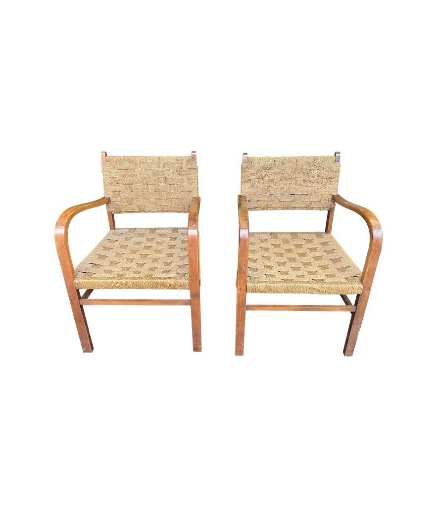 A lovely pair of 1950s French bentwood chairs in the style of Erich Dieckmann with orignal woven rope seats in good original condition