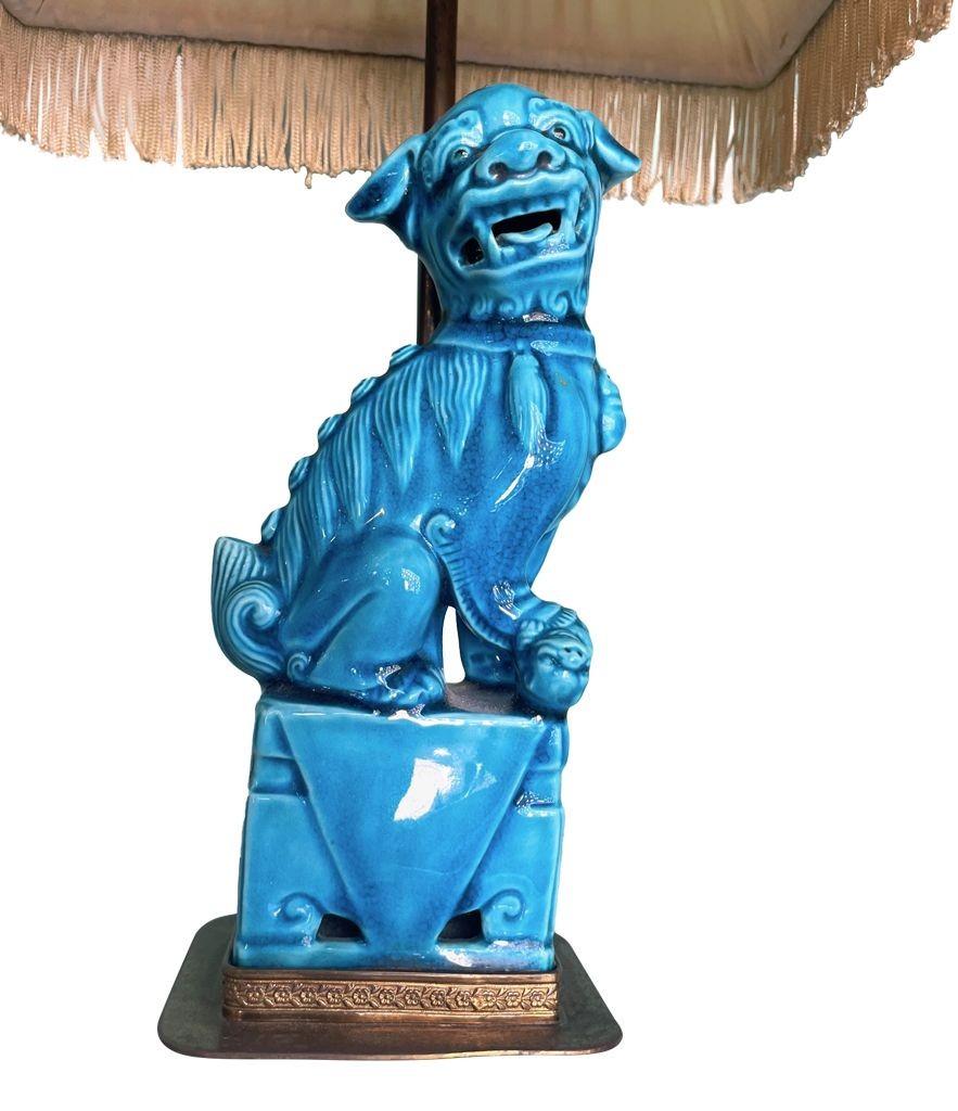 A pair of 1950s ceramic foo dog lamps on decorative brass base 1