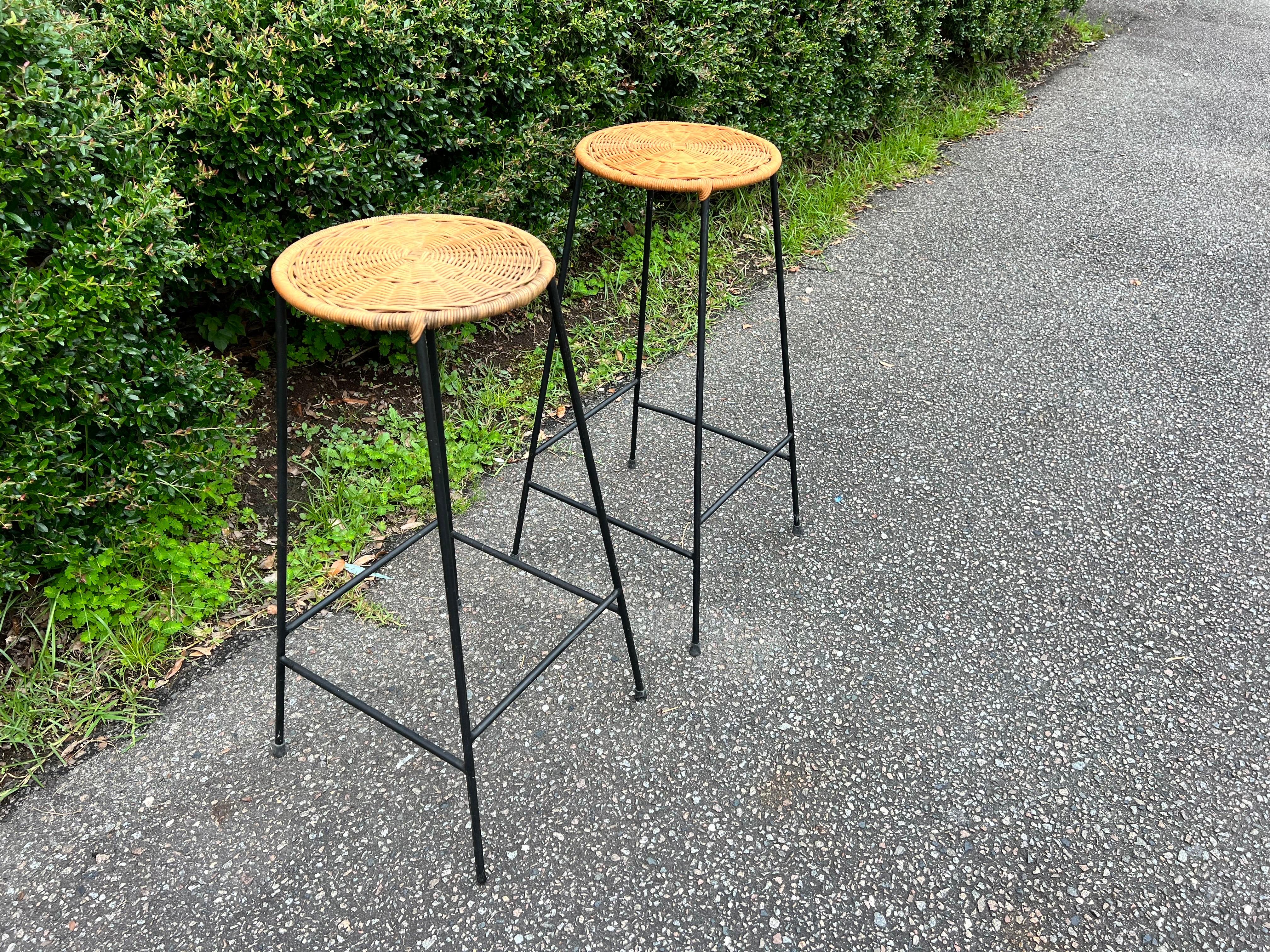 American A pair of 1950’s Danny Ho Fong Style Counter Height Bar Stools in iron and wicke