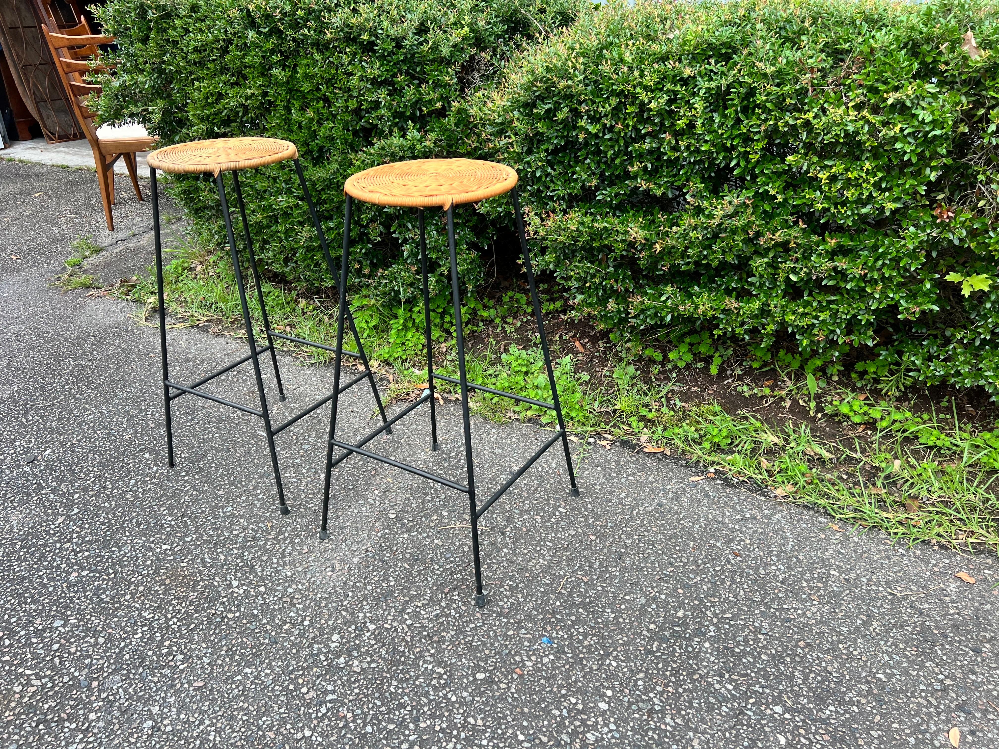 A pair of 1950’s Danny Ho Fong Style Counter Height Bar Stools in iron and wicke In Good Condition In Charleston, SC
