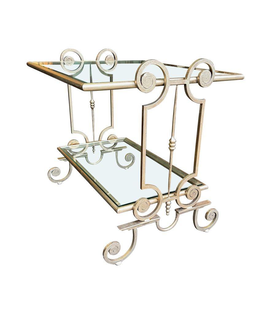 A pair of 1950s gilt wrought iron French side tables, with glass shelves For Sale 1