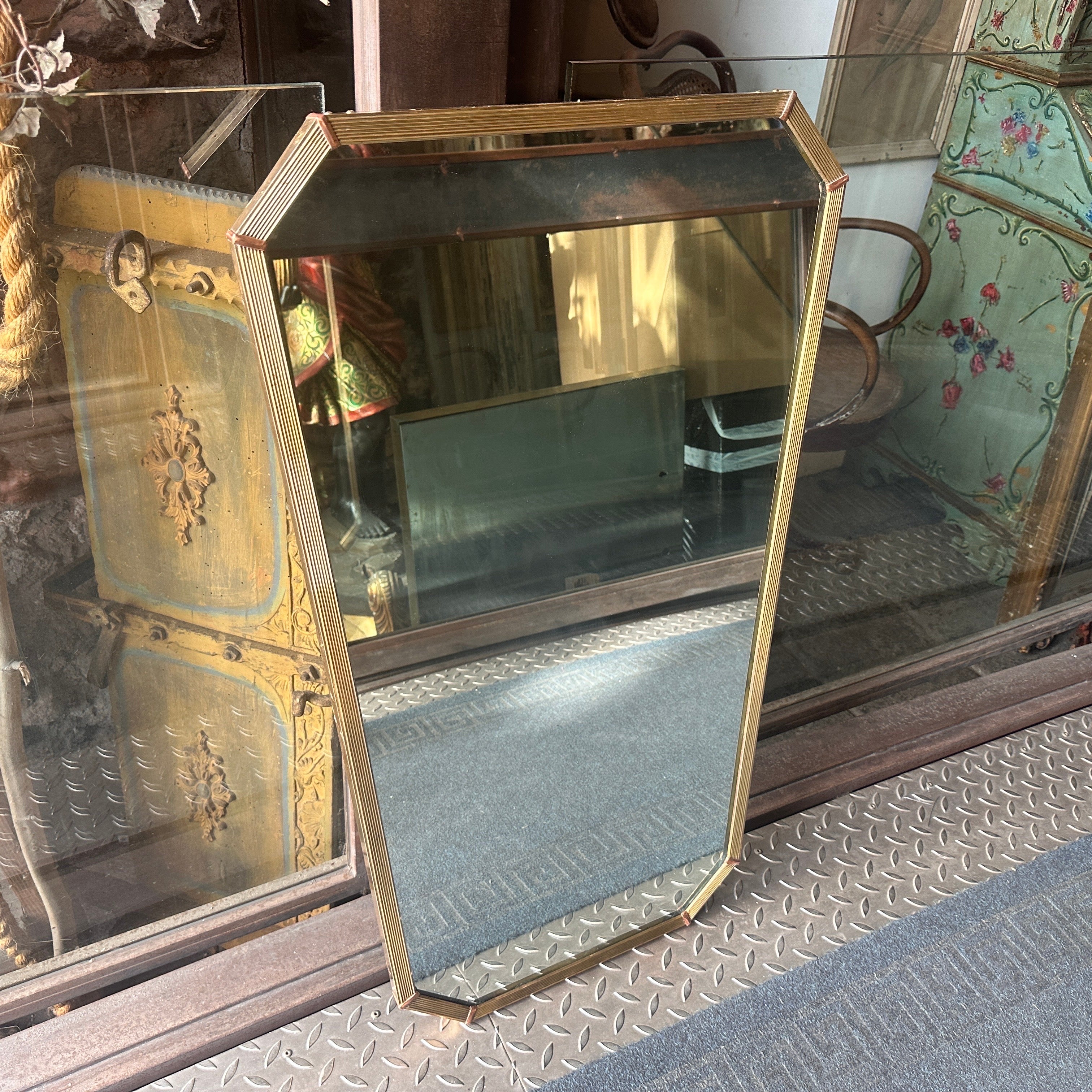 A pair of octagonal wall mirrors designed and manufactured in Italy in the Fifties in the manner of Gio Ponti who used these mirrors to furnish the best houses in Milano in the Fifties. These Wall Mirrors are not only functional mirrors but also