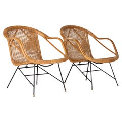 A Pair of 1950s Mid-Century Rattan Basket Chairs in the manner of Arthur Umanoff