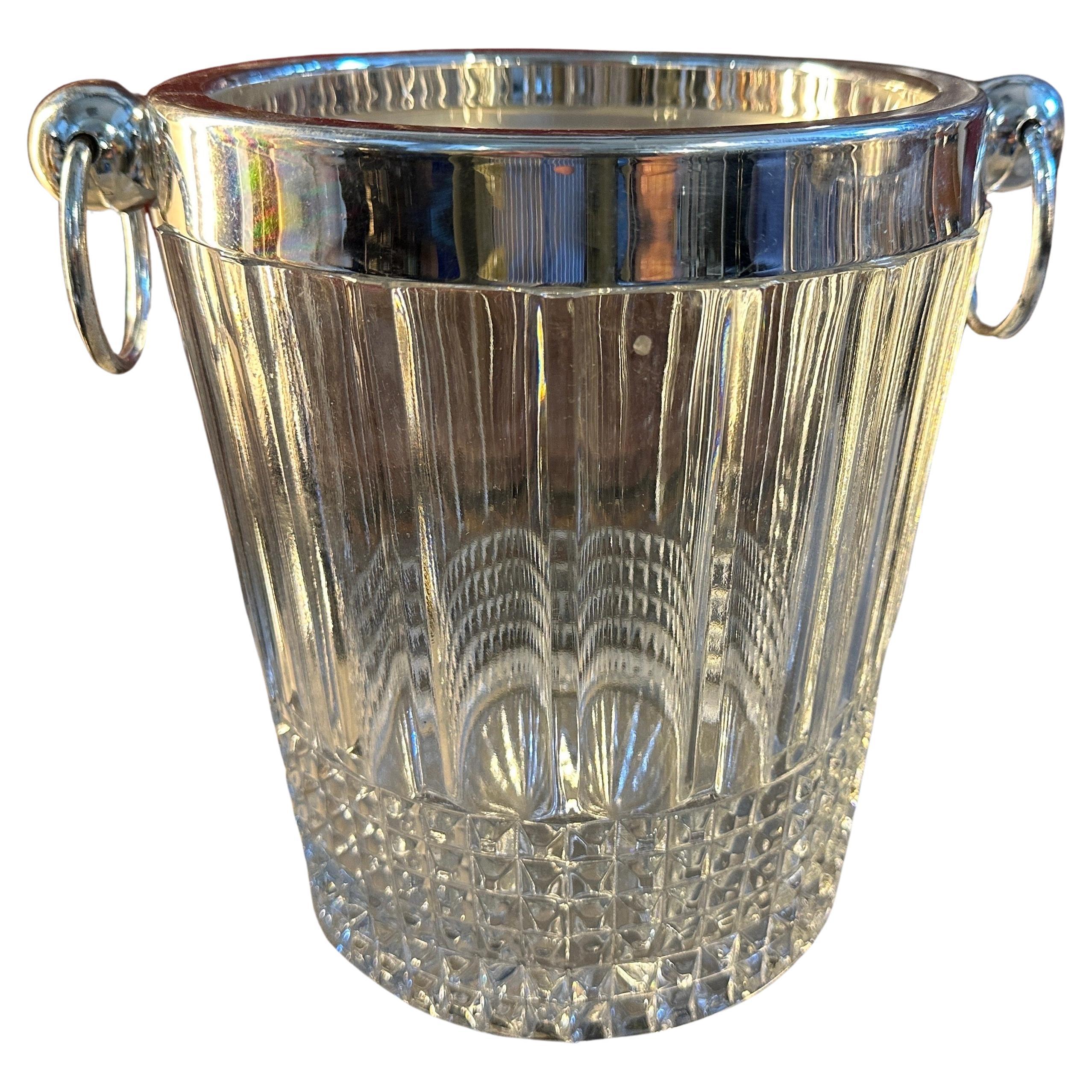 A pair of 1950s Modernist Wine Coolers designed and manufactured in France, high quality heavy crystal and silver plate are in perfect conditions. They exemplify the epitome of sophistication and elegance and showcase a seamless blend of crystal and