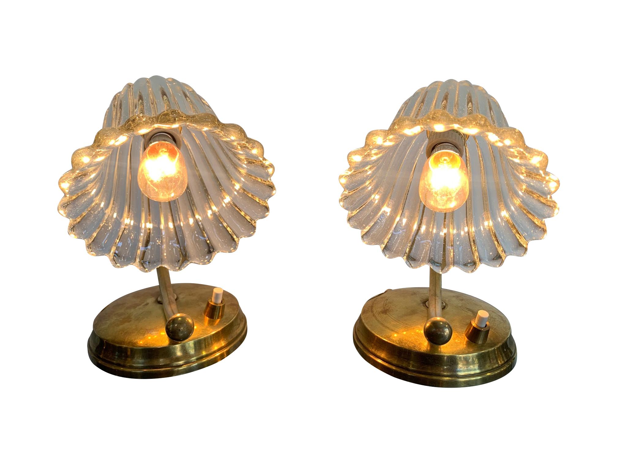 A pair of lovely 1960s Barovier style Italian lamps with glass flower shaped shades and brass base with a hinged arm on the shade. These lamps could be used as table lamps or wall lamp. Re wired with antique gold flex and PAT tested.