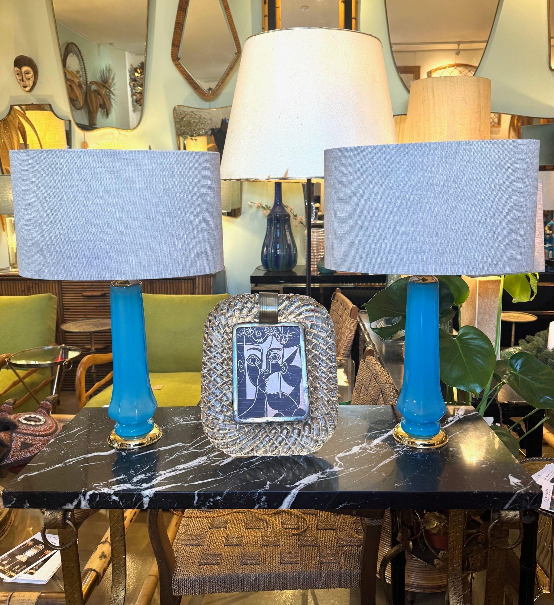 A pair of 1960s turquoise blue Murano opaline glass lamps by Giovanni Cenedese with brass bases and fittings. Re wired with antique gold cord flex, switch and PAT tested