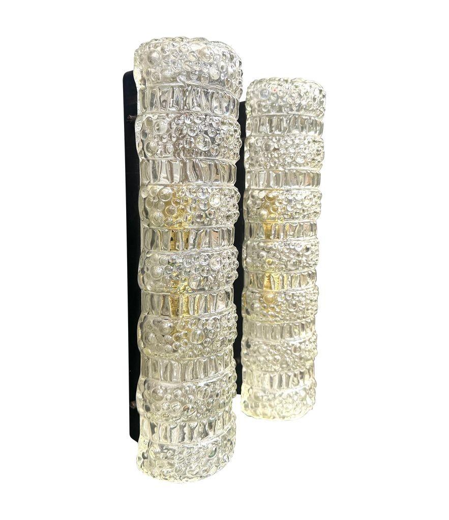Mid-Century Modern A pair of 1960s clear geometric textured glass wall lights For Sale