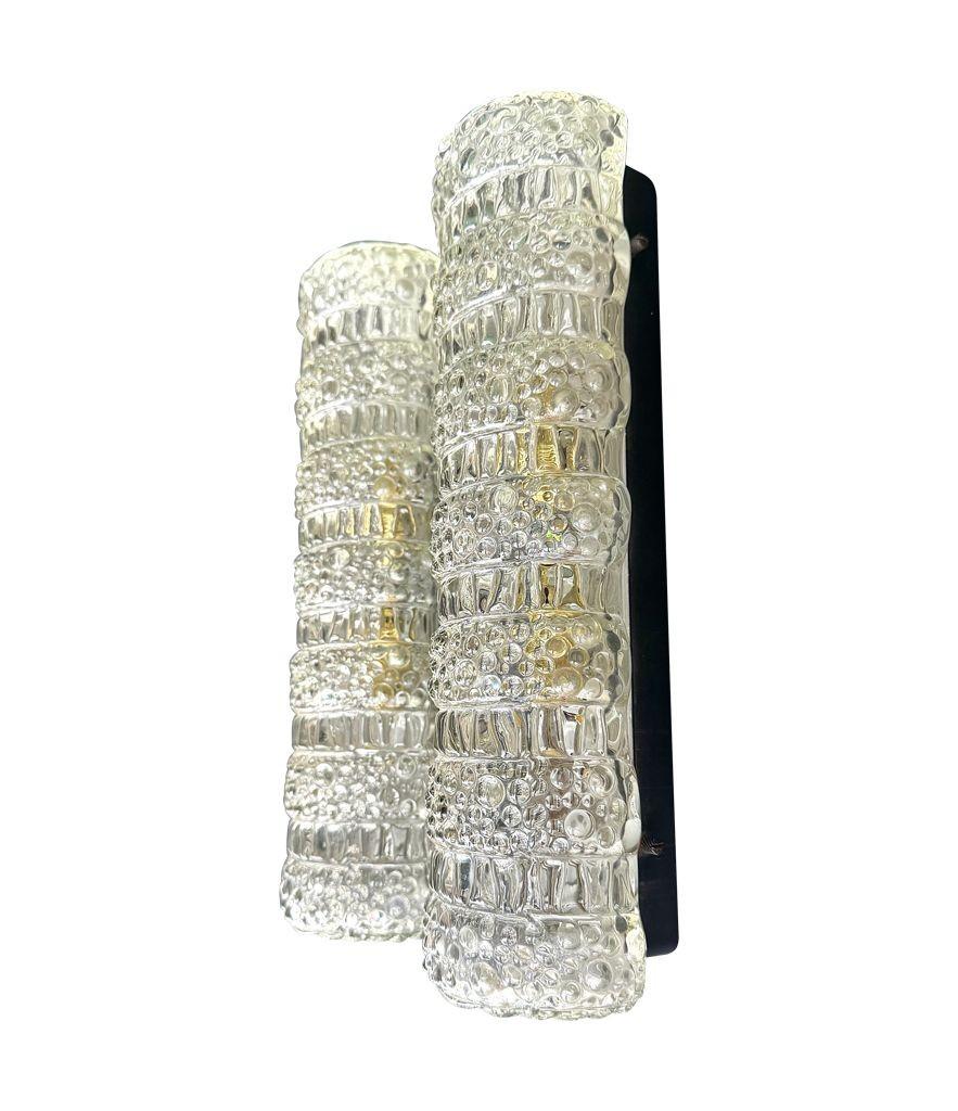 German A pair of 1960s clear geometric textured glass wall lights For Sale