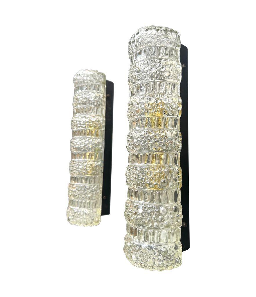 Metal A pair of 1960s clear geometric textured glass wall lights For Sale