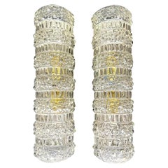 A pair of 1960s clear geometric textured glass wall lights