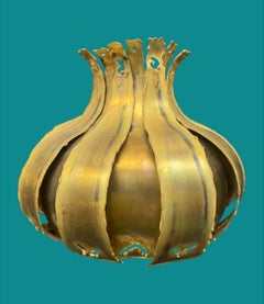 A pair of 1960s Holm Sorensen torch cut brass wall sconces