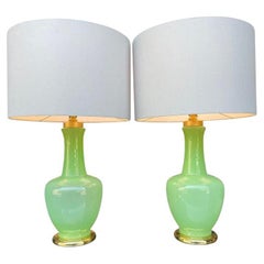 A pair of 1960s lime green opaline Murano glass and bras lamps by Gino Cenedese