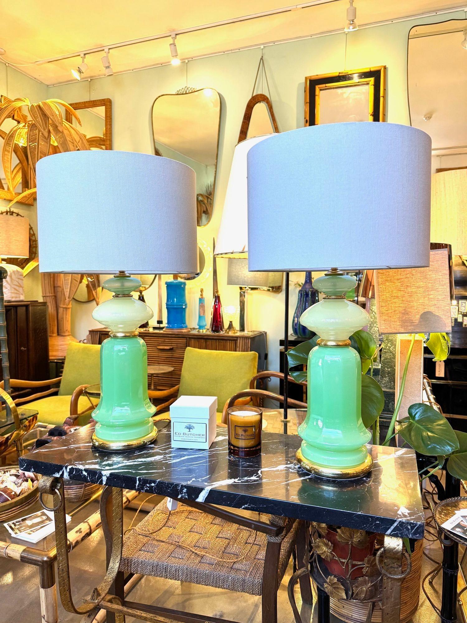 A wonderful pair of 1960s Murano glass, lime green opaline lamps with brass base and fittings by Giovanni Cenedese. Re wired with new brass fittings, antique gold cord flex, switch and PAT tested. Dimensions without shades 48cm high x 15cm diameter