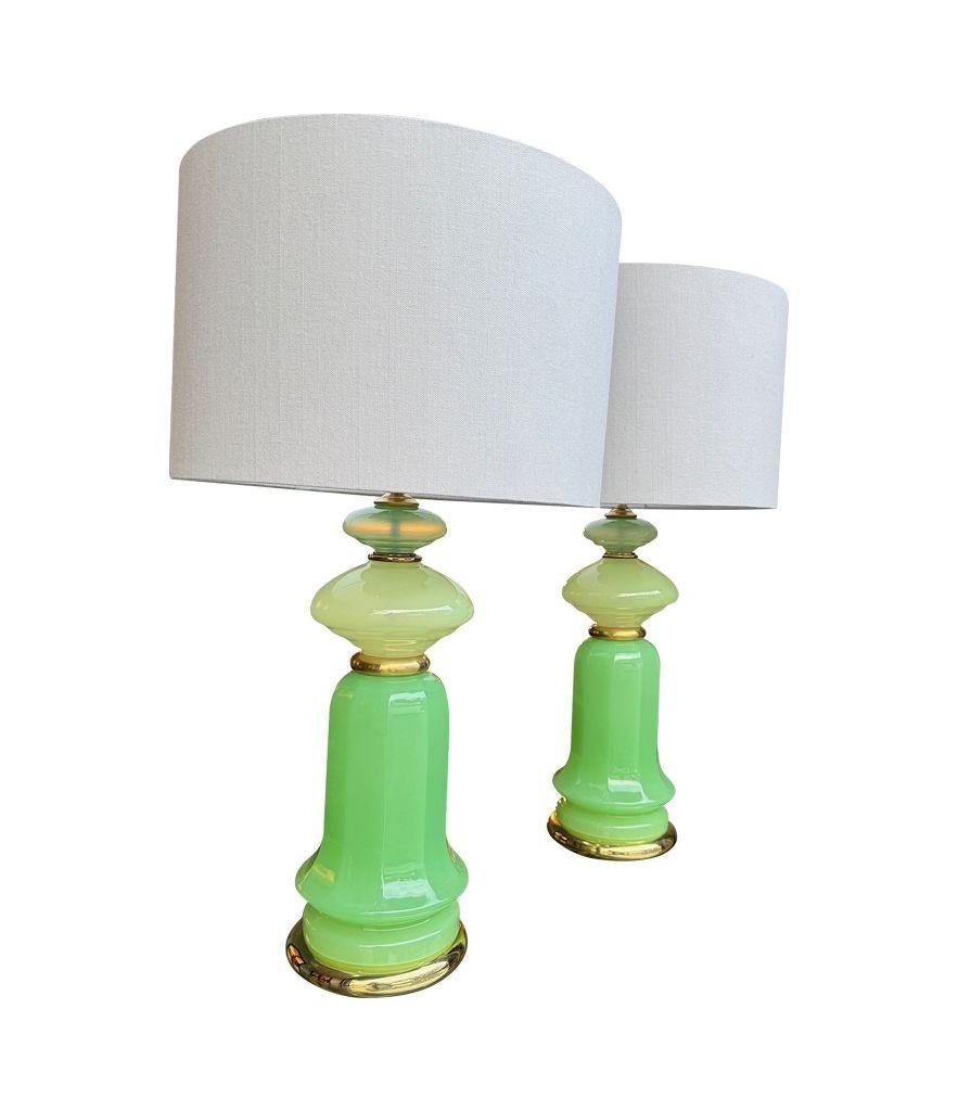 A pair of 1960s Murano glass green opaline lamps with brass base and fittings 1