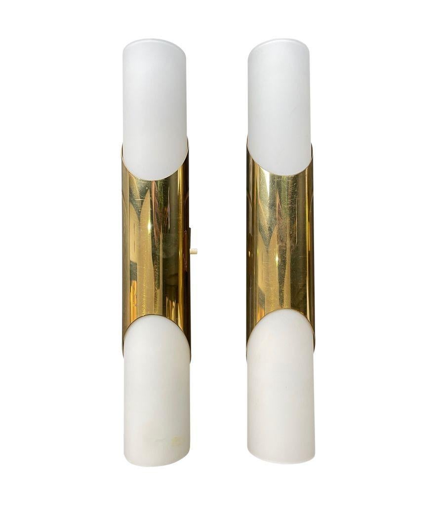 Brass A pair of 1960s Neuhaus Leuchten white oplaine and brass wall sconces For Sale
