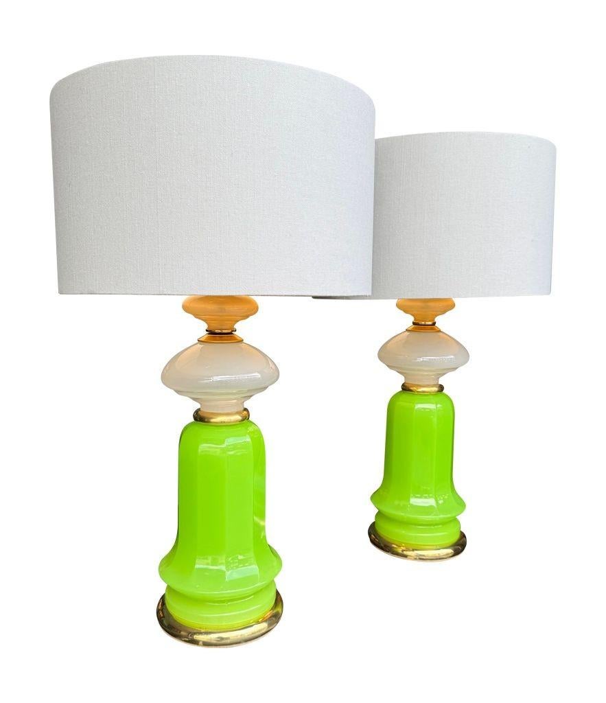 A wonderful large pair of 1960s opaline Murano glass lamps by Gino Cenedese, with vibrant lime green, white and pastel pink Murano opaline glass sections mounted on a brass base and stem. Re wired with new brass fittings, antique cord flex and PAT