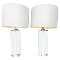 A pair of 1960s Orrefors glass lamps with white glass core and nickel fittings