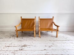 A Pair of 1960's Spanish Leather Sling Armchairs