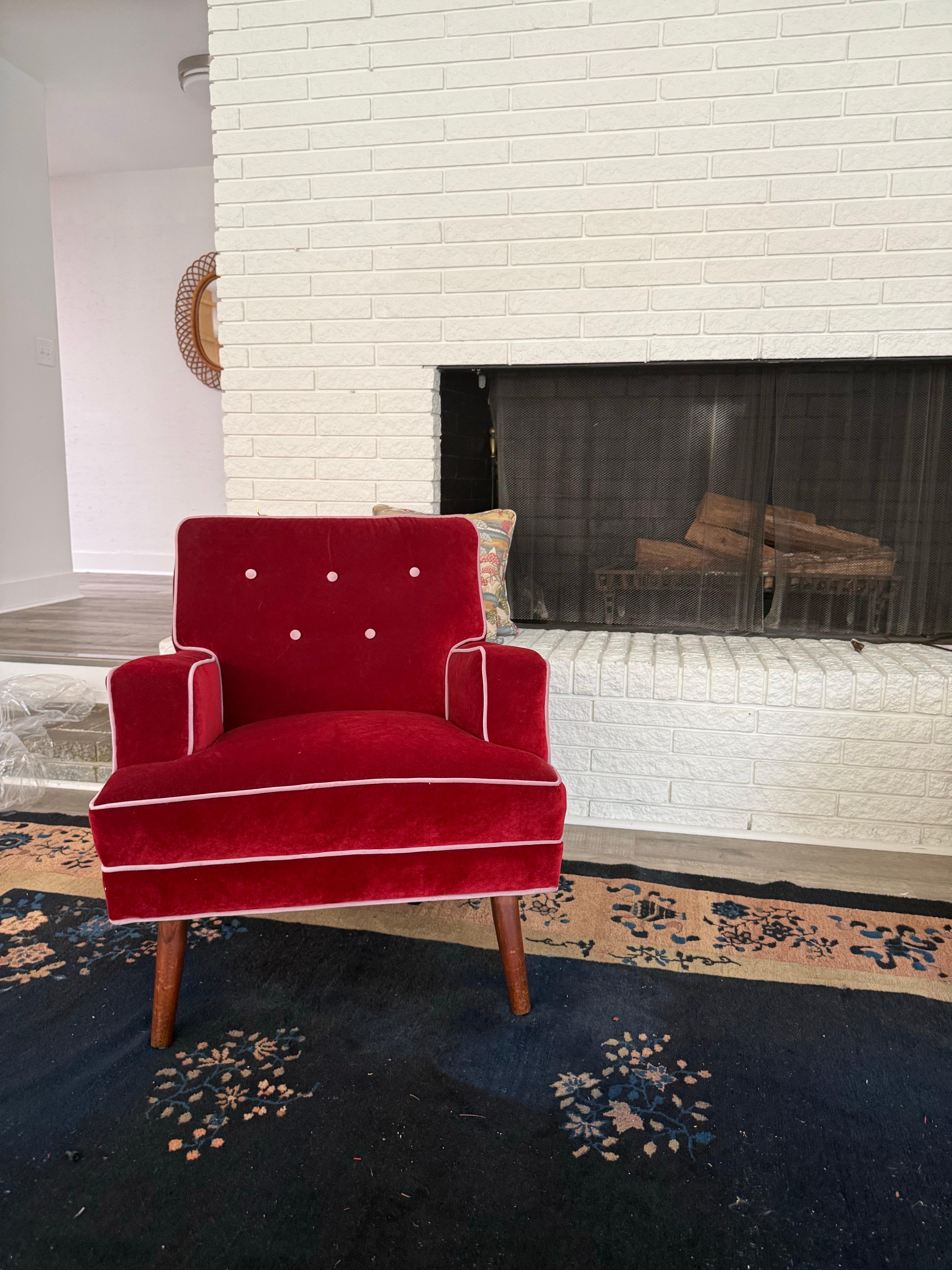 An absolutely stunning pair of newly upholstered Swedish modern club chairs in a Merlot velvet with lavender piping (they photographed more red than they actually are).   This color combo is so timeless and fits with just about any style.  Button