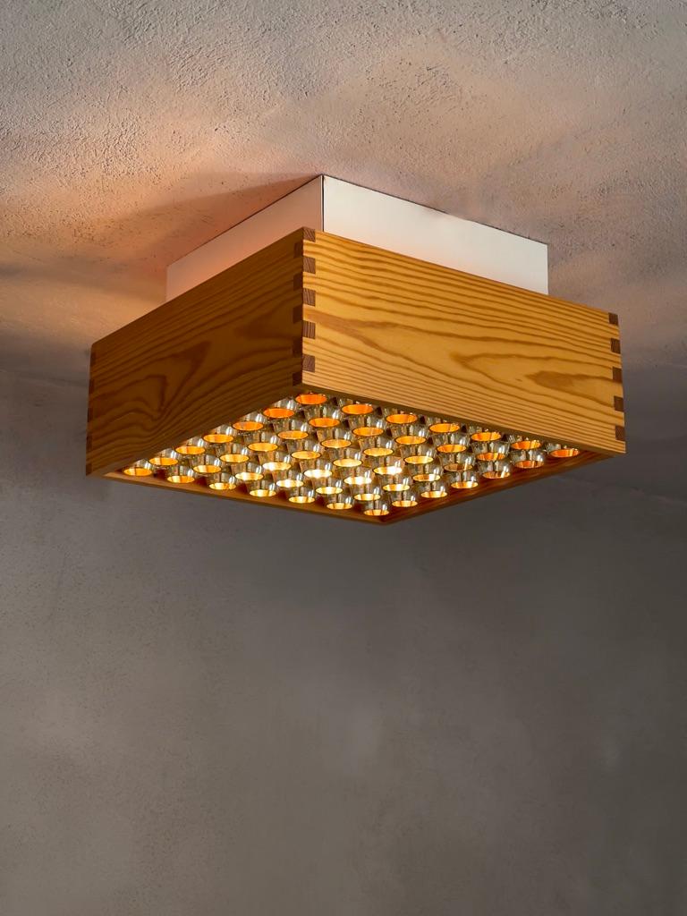 Danish A pair of 1970s danish ceiling lights in patinated finger-jointed pine. (2)