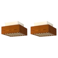 A pair of 1970s danish ceiling lights in patinated finger-jointed pine. (2)