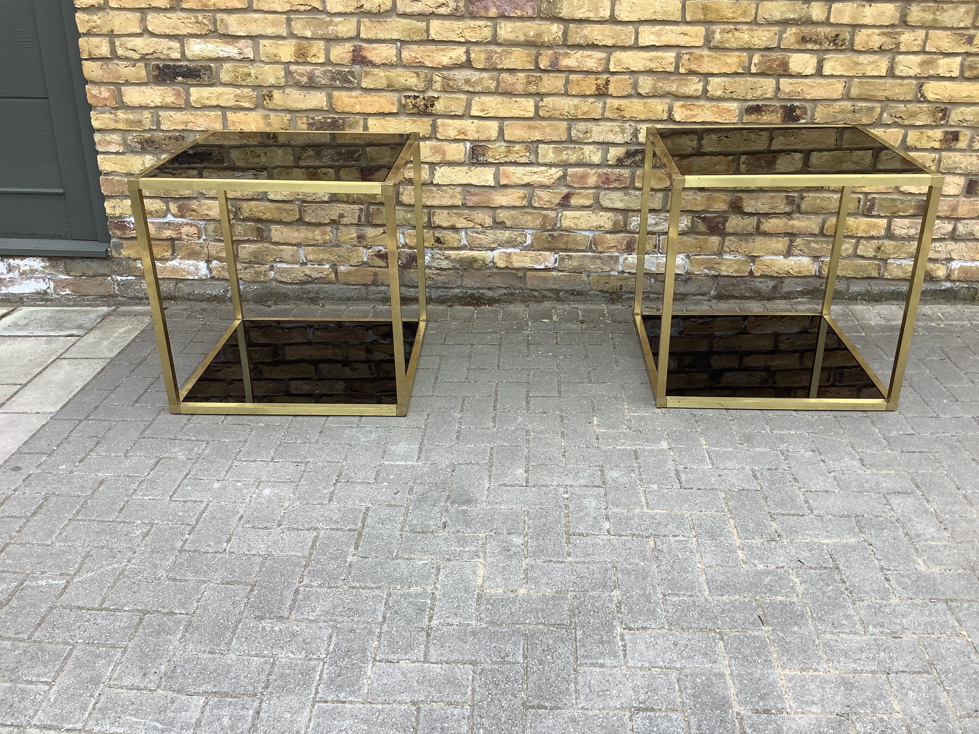 A pair of superb display table with two levels brass frame black glass surfaces
Extremely decorative item.