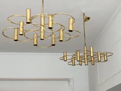 A Pair of 1970's Italian Brass Plated Circle Chandeliers