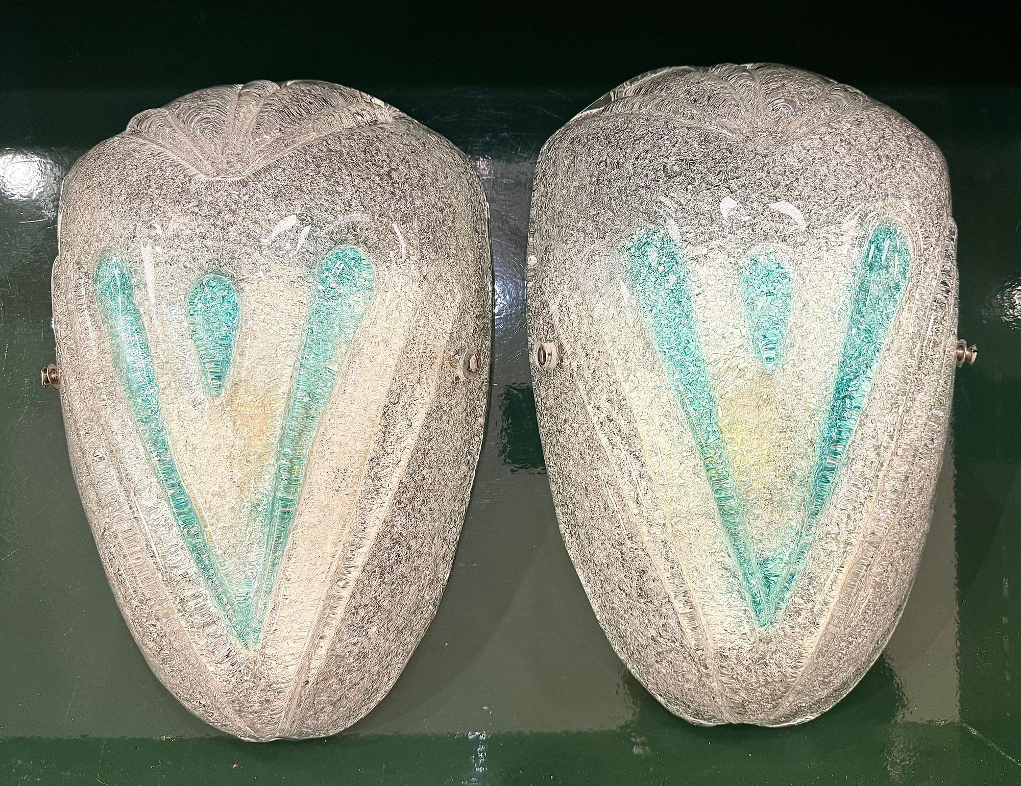 A pair of 1970s Italian frosted Murano glass wall sconces with teal green detail. Mounted on a white enamel wall plate and rewired with new chrome fittings and PAT tested.