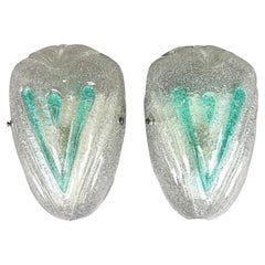 A pair of 1970s Italian Murano glass wall sconces with teal green detail