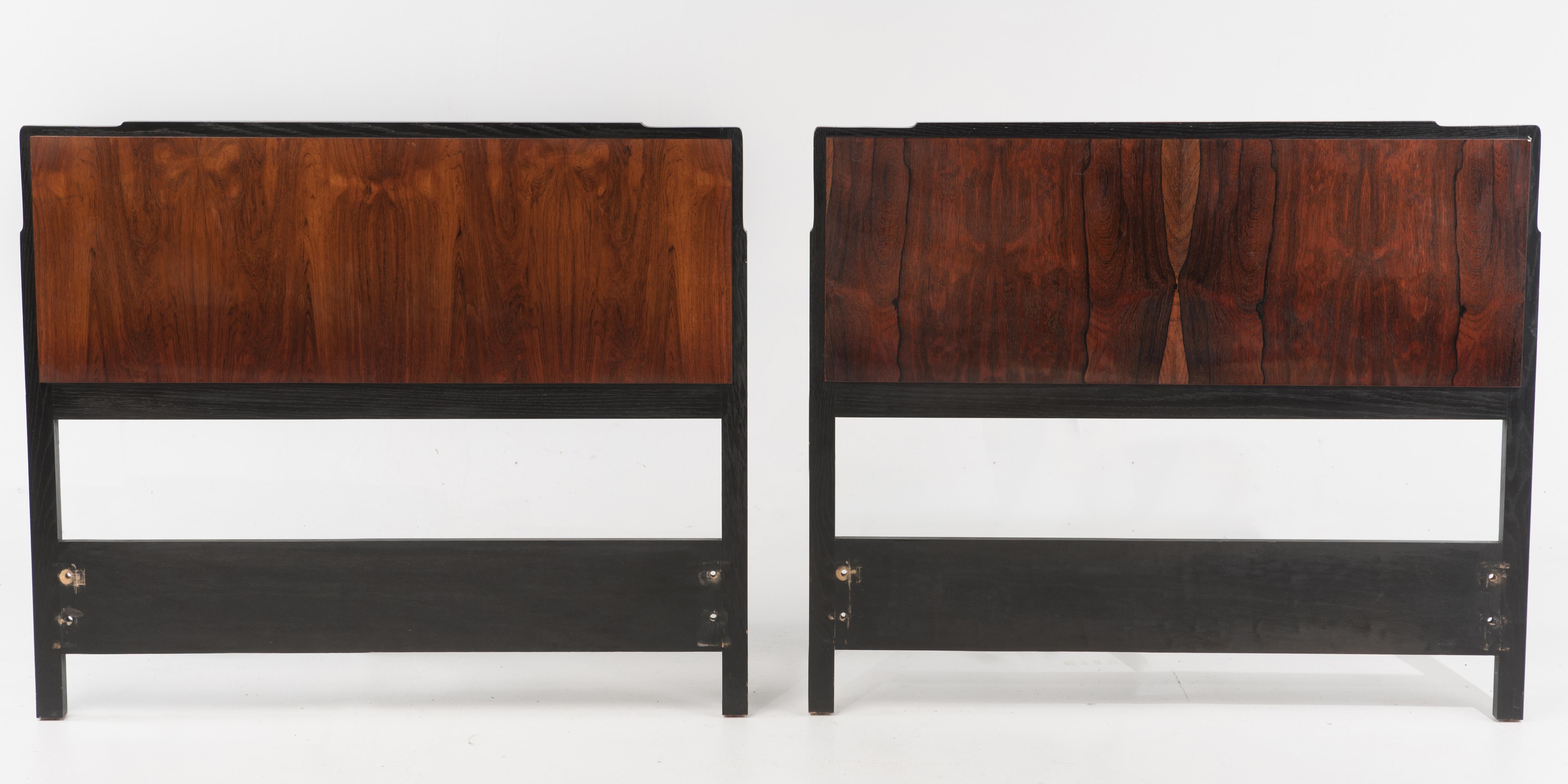 A wonderful pair of midcentury cloud form rosewood and ebonized oak twin headboards. There is a stenciled number, but no mark. The rosewood panels are 13.8 H x W 39. Well made, very similar to a known Harvey Probber form.