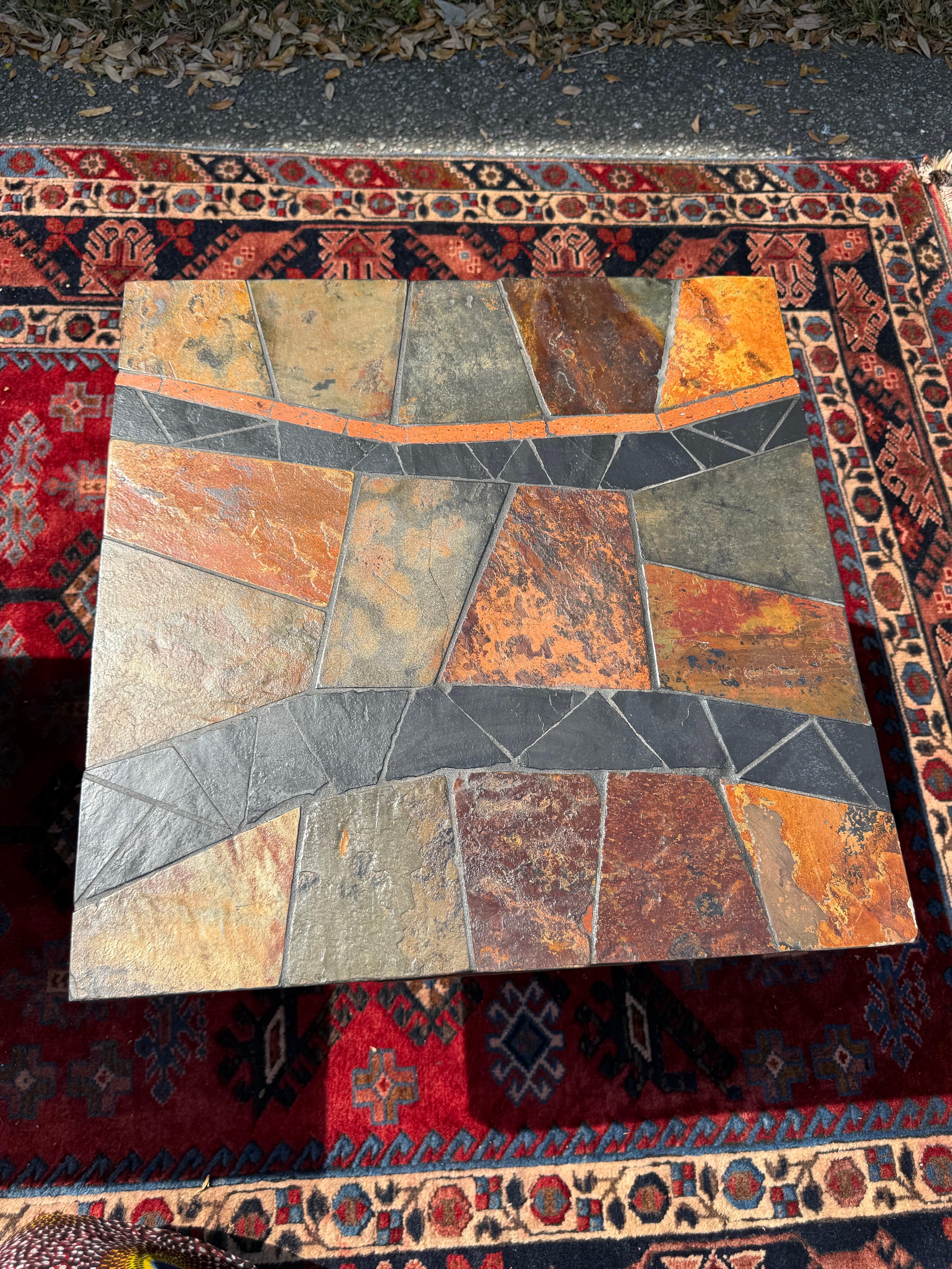 Paul Kingma style The tables are slate with multicolored inlays of terracotta, ceramic, and many different color natural stone with slate bases.  No 2 tables are the same. Paul Kingma is a Dutch sculptor, mosaic artist and painter (1913-2013), born